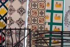 Quilts hanging at Amish auction, Minden